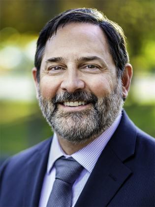 Daniel Chatigny headshot photo in suit and tie