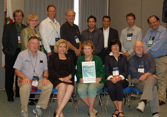 Attendees from participating Beacon Award agencies gather for a photo